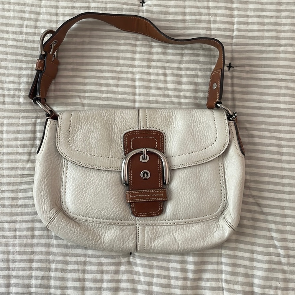 This cream cutie Coach bag was one of my first adulting purchases.